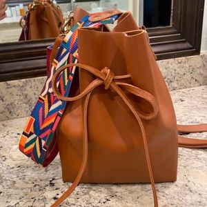 Faux leather bag with guitar strap